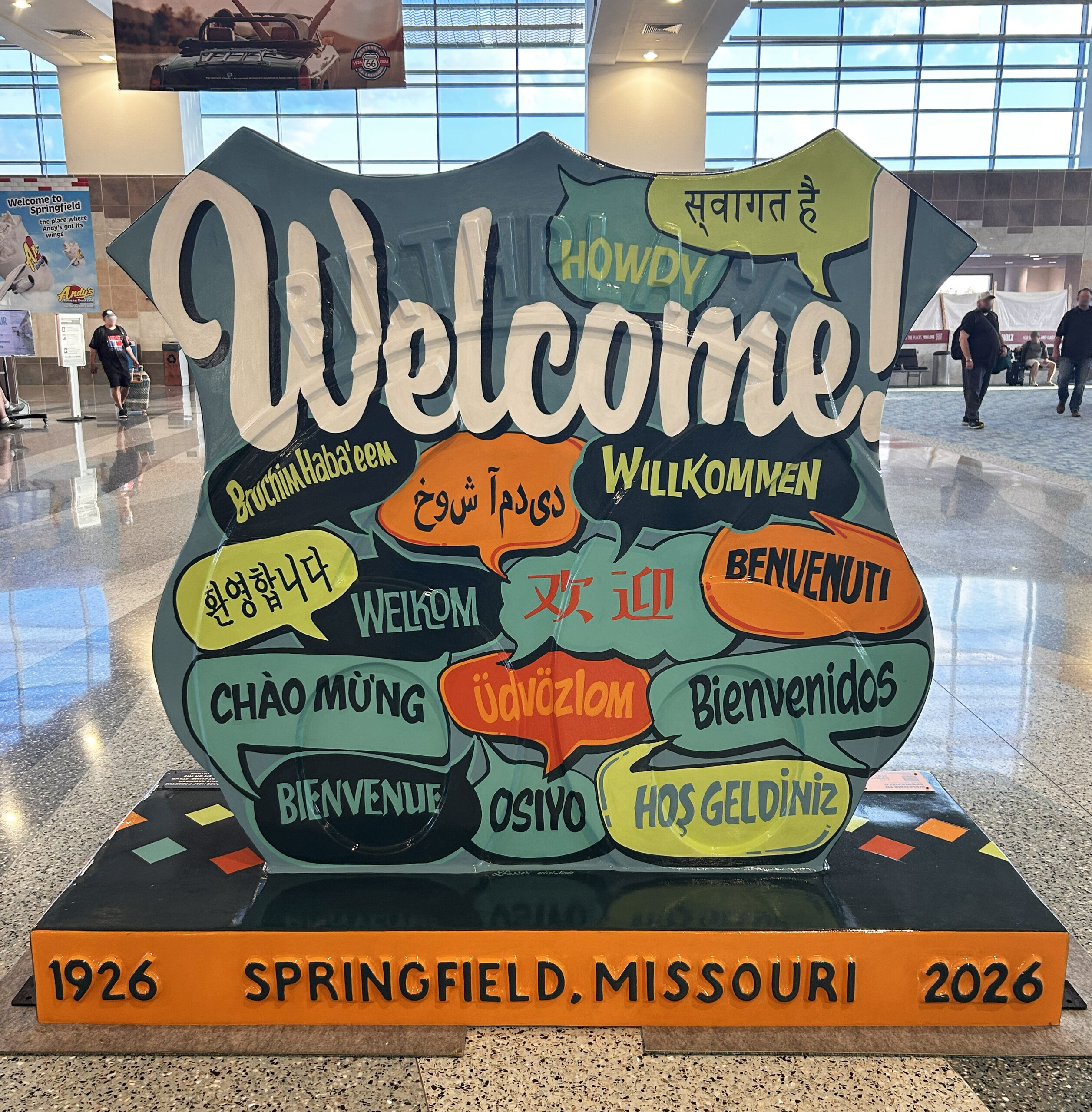 colorful welcome sign at the airport